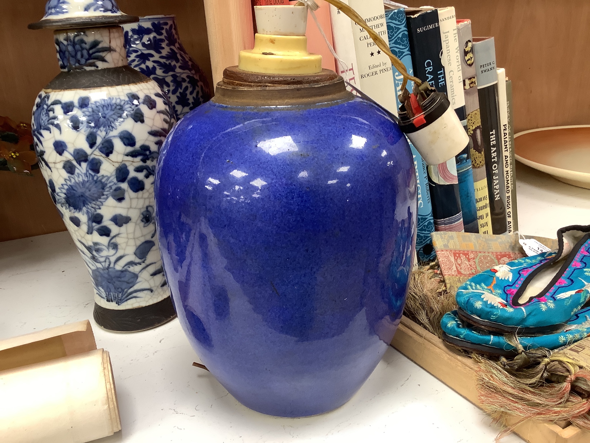 A 19th century Chinese blue and white vase, a similar crackle glaze vase and a powder blue jar, mounted as a lamp, tallest 32cm